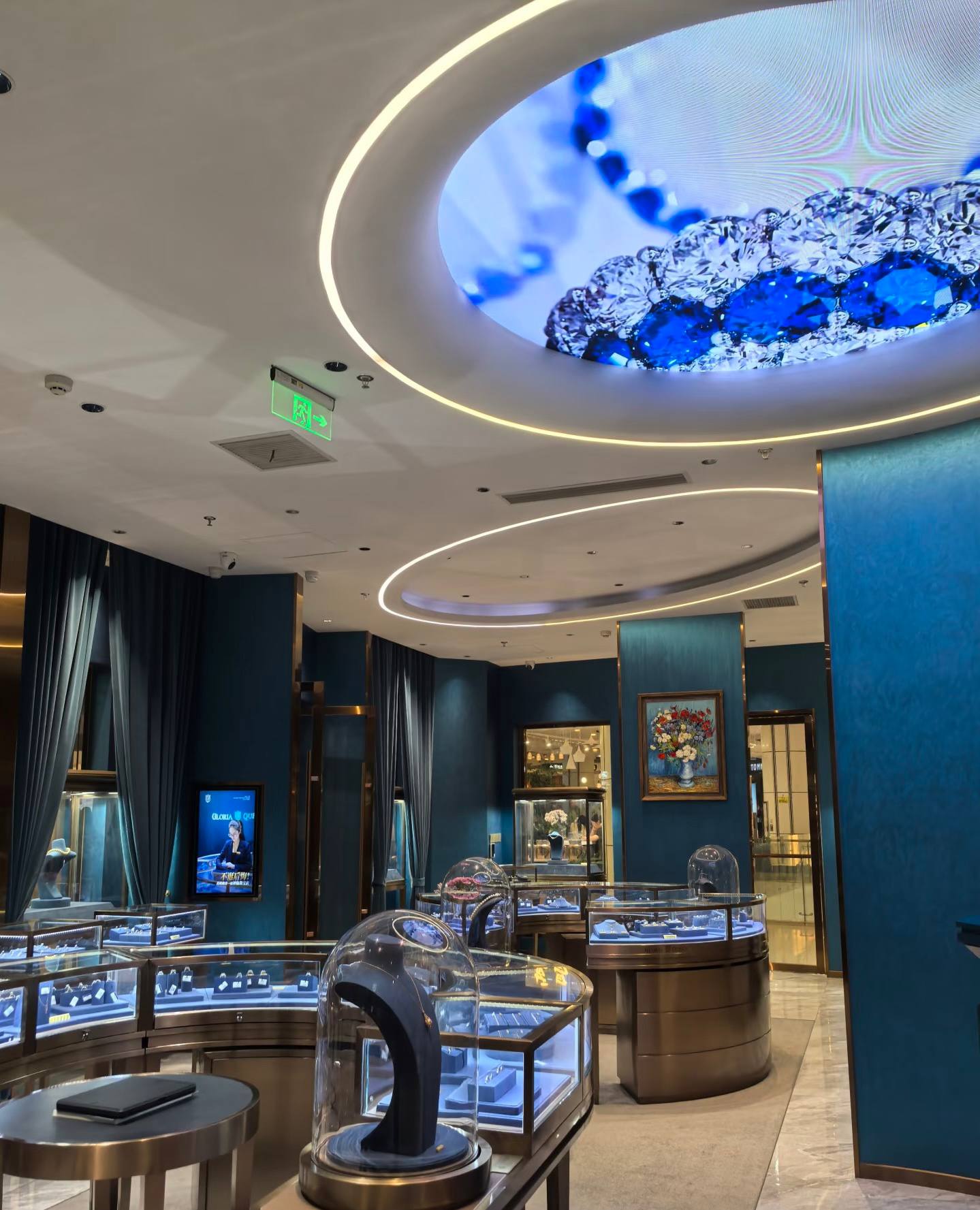 Jewelry showroom ceiling with circular light and gemstone display screen